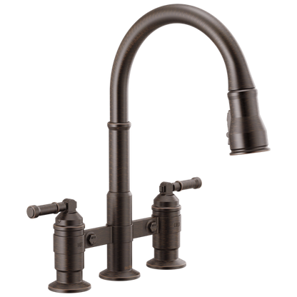 Delta - Broderick Two Handle Pull-Down Bridge Kitchen Faucet
